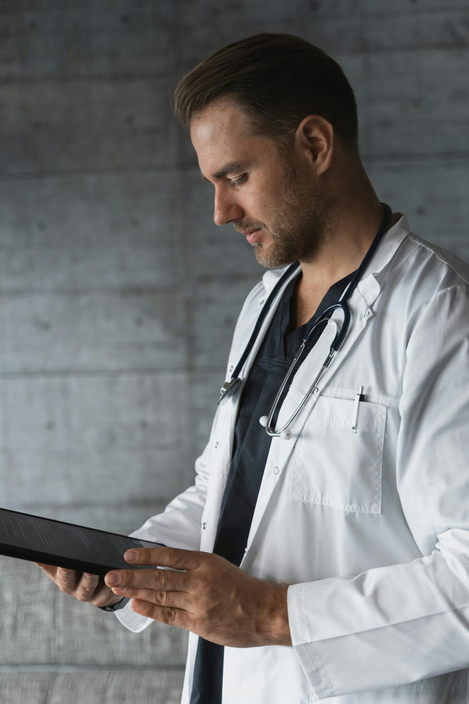Doctor reviewing TRT bloodwork and baseline testing
